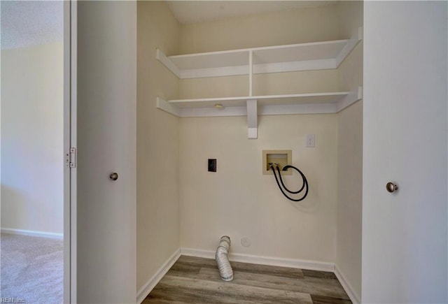 washroom featuring hookup for a washing machine, hardwood / wood-style flooring, and hookup for an electric dryer