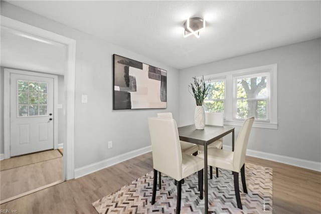 dining area with light wood-type flooring