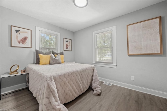 bedroom featuring dark wood-type flooring