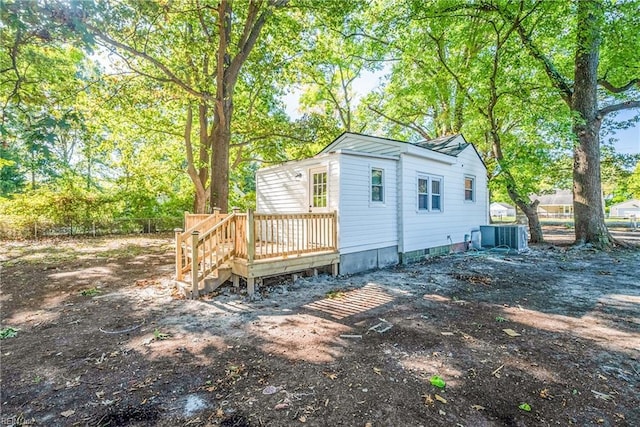 back of property with a wooden deck