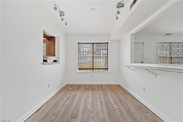 unfurnished dining area featuring light hardwood / wood-style flooring