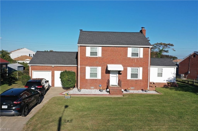 view of front of home featuring a front lawn and a garage