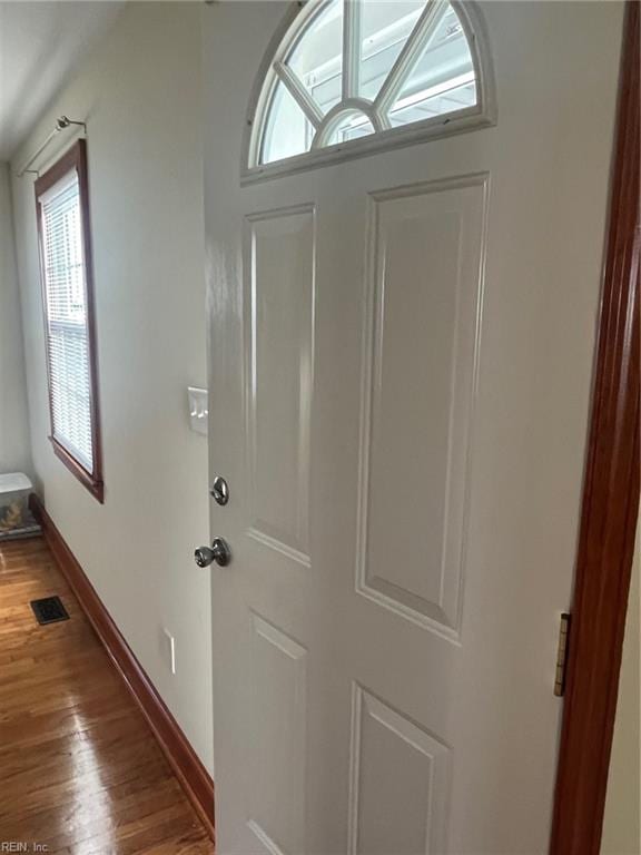 entryway with hardwood / wood-style floors