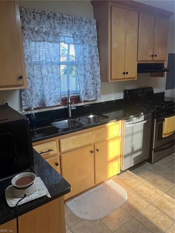 kitchen featuring light brown cabinets, stainless steel appliances, sink, and light tile patterned floors