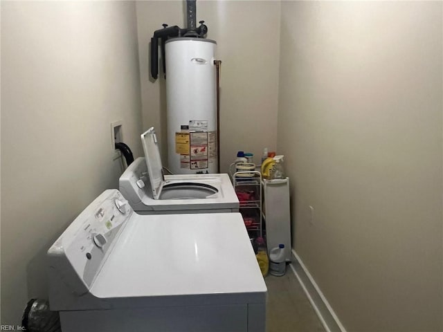 laundry area with water heater and washer and dryer