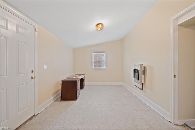 clothes washing area with heating unit and light colored carpet