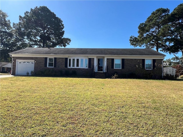 ranch-style home with a front yard and a garage