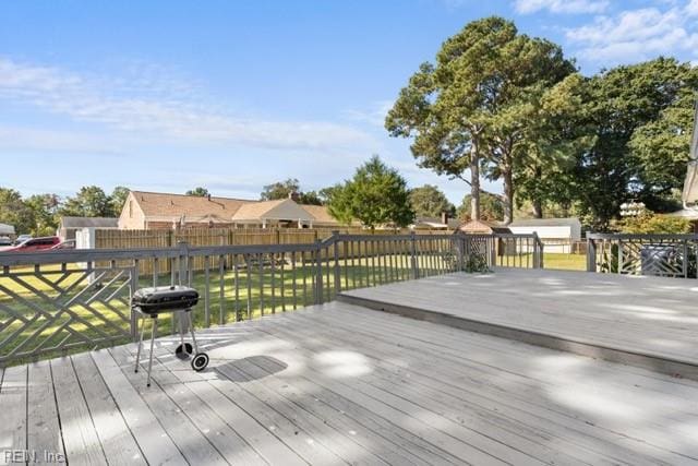 wooden deck featuring grilling area