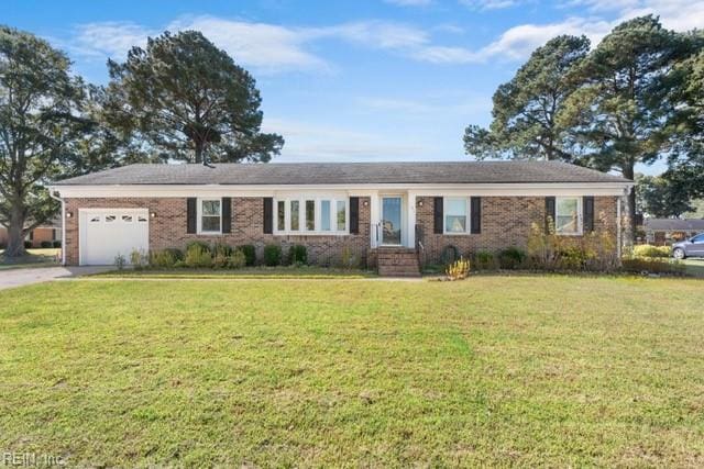 ranch-style home with a front lawn and a garage