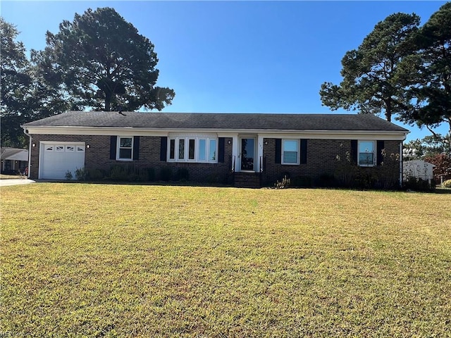 ranch-style house featuring a front lawn and a garage