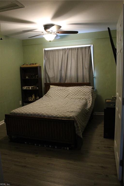 bedroom featuring ceiling fan and dark hardwood / wood-style flooring