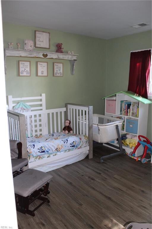 bedroom featuring hardwood / wood-style flooring