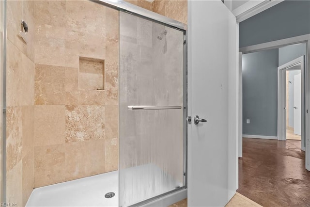 bathroom featuring concrete floors and walk in shower