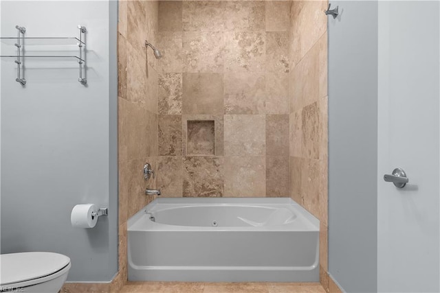 bathroom featuring tile patterned floors and toilet