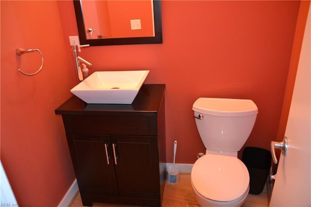 bathroom featuring vanity, toilet, and tile patterned floors