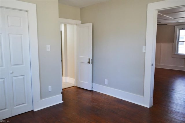 unfurnished bedroom featuring dark hardwood / wood-style floors