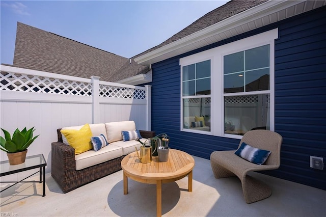 view of patio featuring fence and an outdoor living space