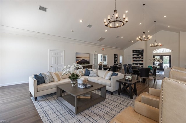 living room featuring an inviting chandelier, wood-type flooring, and high vaulted ceiling