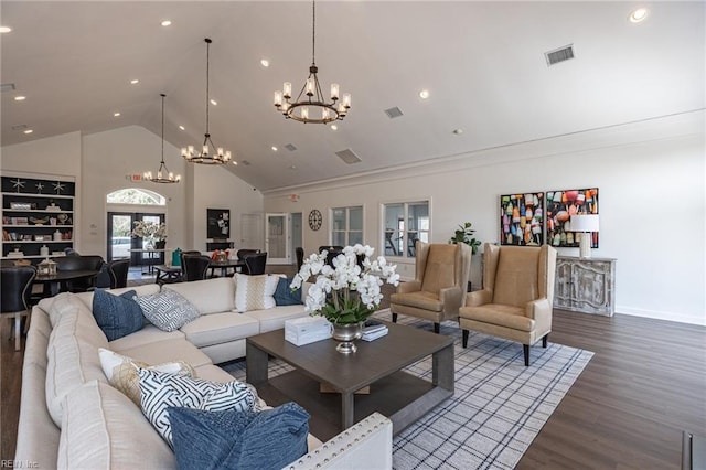 living room with dark hardwood / wood-style flooring, a notable chandelier, and high vaulted ceiling