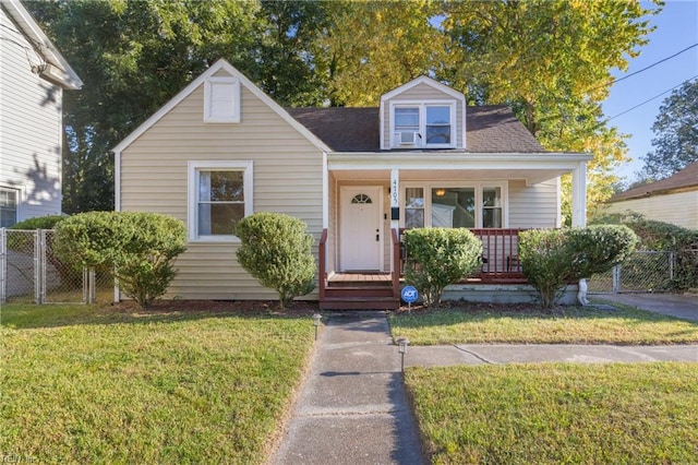 view of front of property with a porch and a front lawn