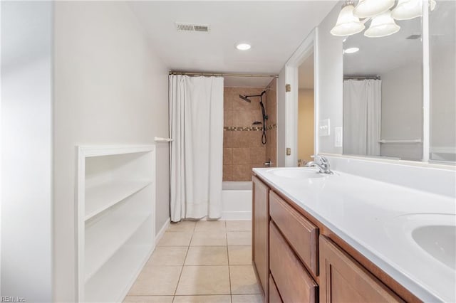 bathroom featuring vanity, tile patterned floors, shower / tub combo, and a chandelier