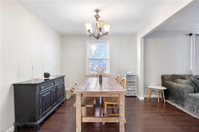 dining room with an inviting chandelier and dark hardwood / wood-style flooring