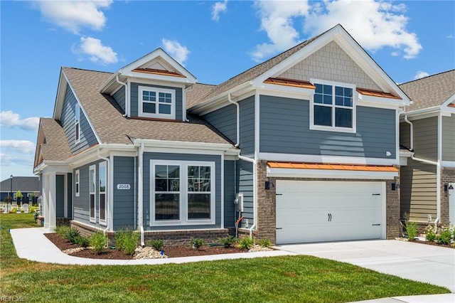 craftsman inspired home with a front lawn and a garage