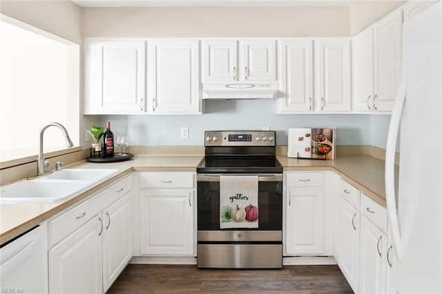 kitchen featuring white cabinets, sink, and white appliances