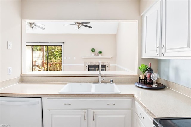 kitchen with sink, white dishwasher, white cabinetry, ceiling fan, and stainless steel range