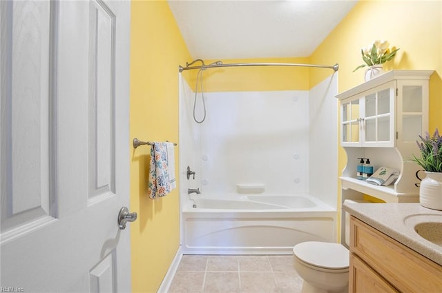 full bathroom with toilet, vanity, washtub / shower combination, and tile patterned flooring