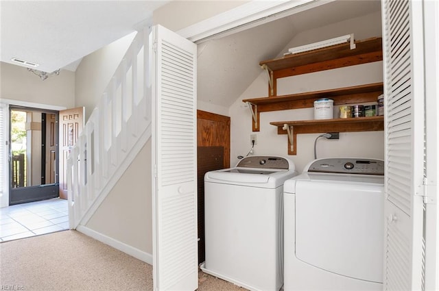 washroom with light carpet and washing machine and dryer