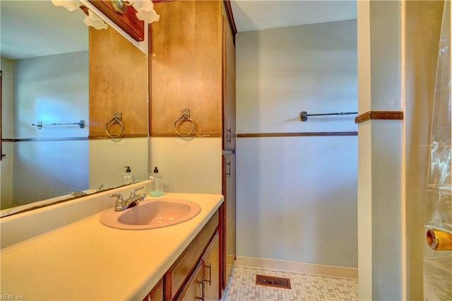 bathroom with vanity and tile patterned floors