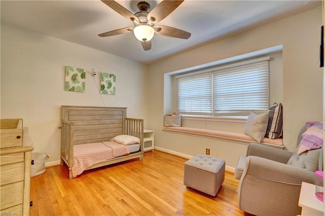 bedroom featuring light hardwood / wood-style flooring and ceiling fan