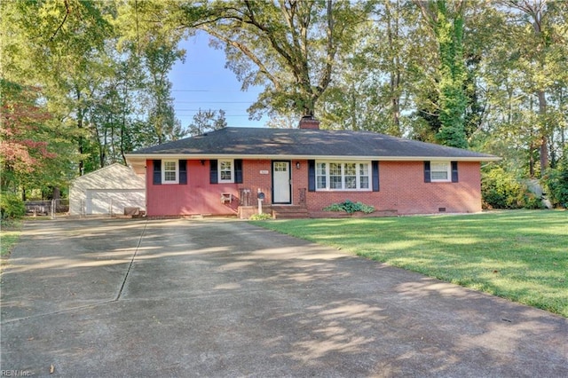 ranch-style home featuring a front yard and an outbuilding