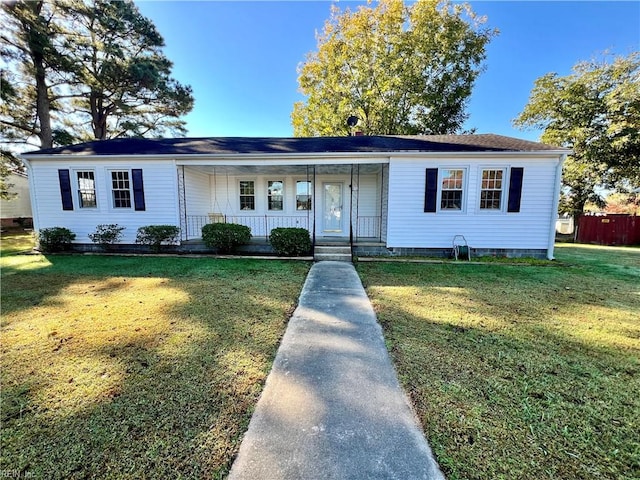 single story home featuring a front lawn and covered porch