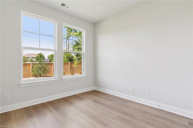 spare room with light wood-type flooring