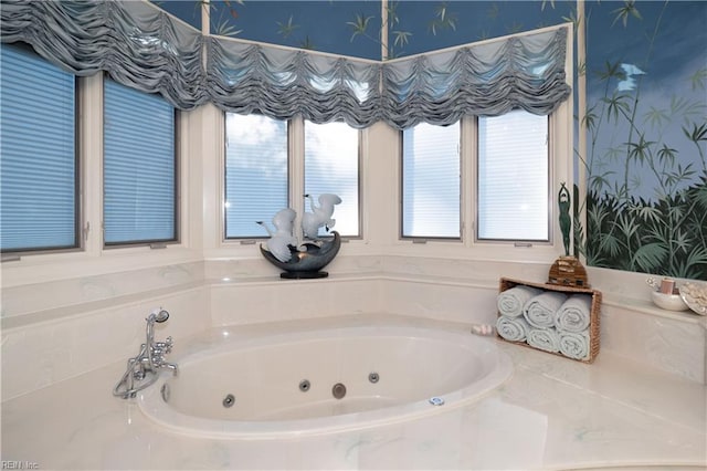 bathroom featuring tiled bath