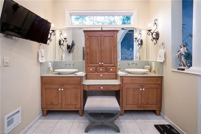 bathroom featuring vanity, backsplash, and tile patterned flooring