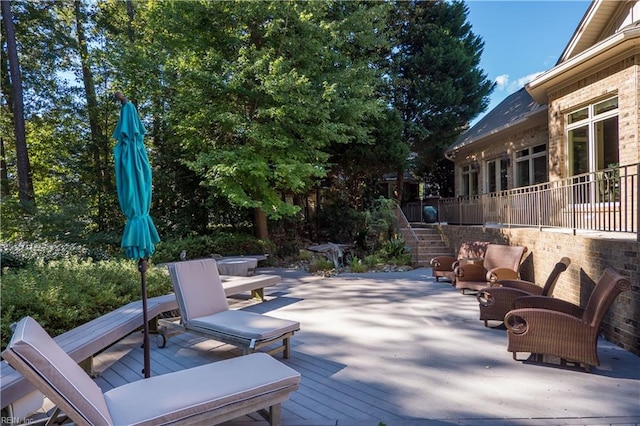 wooden deck with a patio area