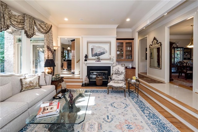 living room featuring ornamental molding and wood-type flooring