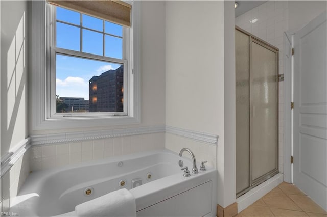 bathroom with tile patterned floors and separate shower and tub