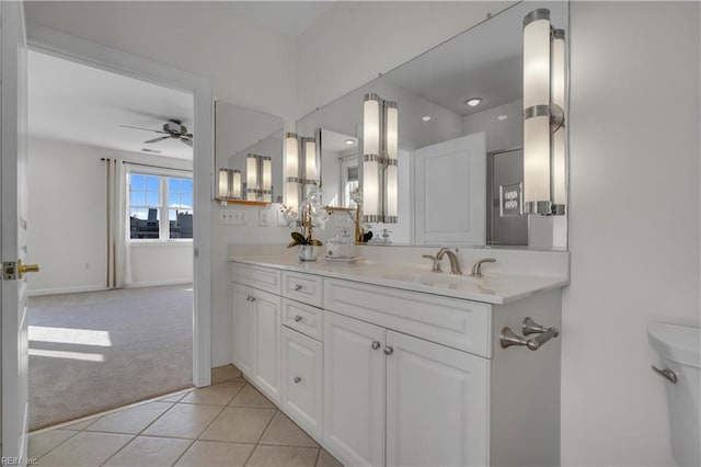 bathroom with vanity, ceiling fan, and tile patterned floors