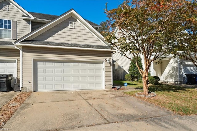 view of property exterior with a lawn and a garage