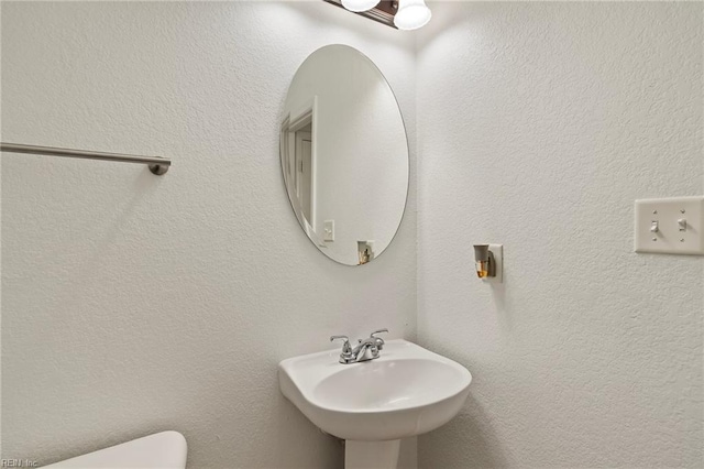 bathroom with sink and toilet