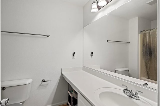 bathroom with a shower with curtain, vanity, and toilet