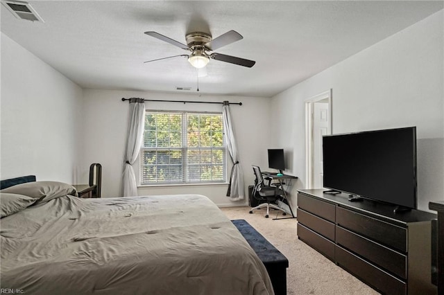 bedroom with light carpet and ceiling fan