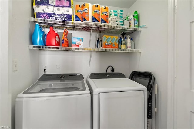 clothes washing area featuring washing machine and clothes dryer