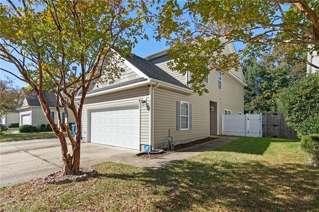 view of property exterior featuring a yard and a garage