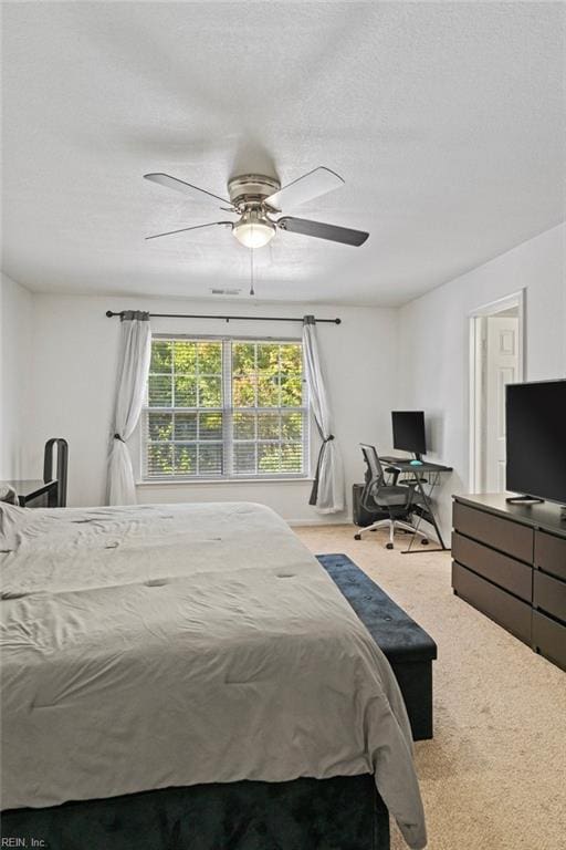 bedroom featuring ceiling fan and light colored carpet