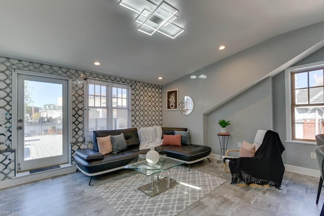 living room with hardwood / wood-style floors and vaulted ceiling